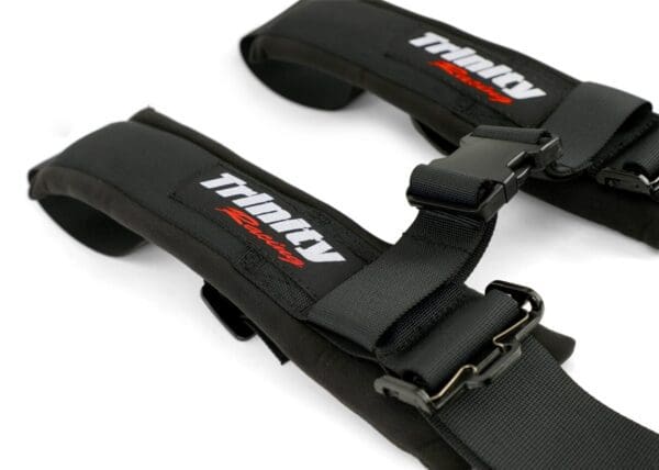 A pair of black racing harness with red lettering.