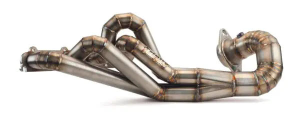 A pair of exhaust pipes that are bent in the same direction.