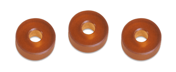 Three wooden donuts are shown in a row.