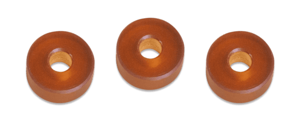 Three wooden donuts are shown in a row.