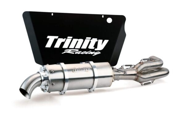 A trinity racing exhaust system with a black plate.